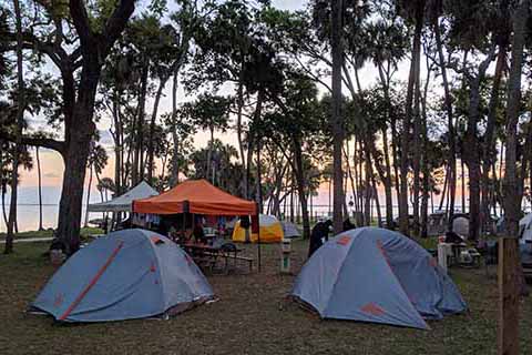 Tents on grass overlooking Indian River